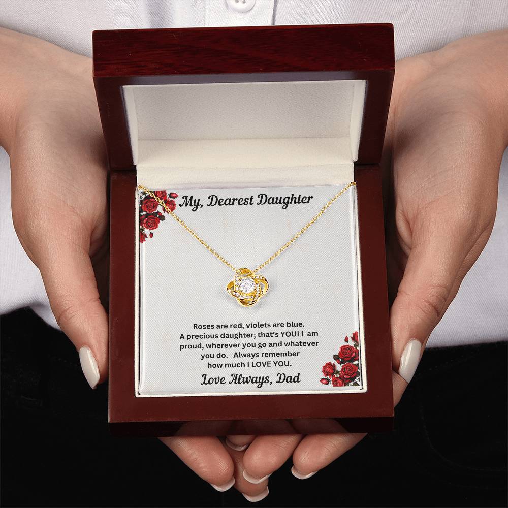 Hands holding Daughter gift from dad with love knot necklace and special message in luxury box