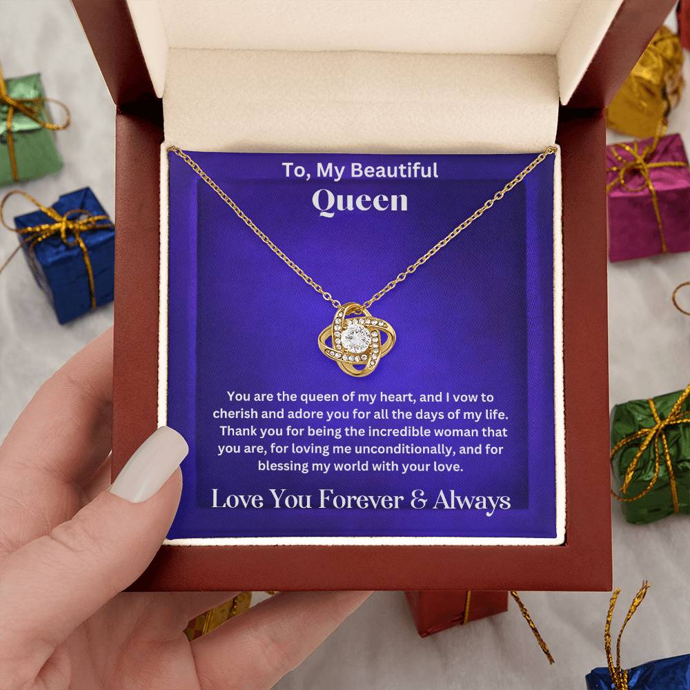 Hand holding Soulmate gift with love knot necklace and special message in luxury box
