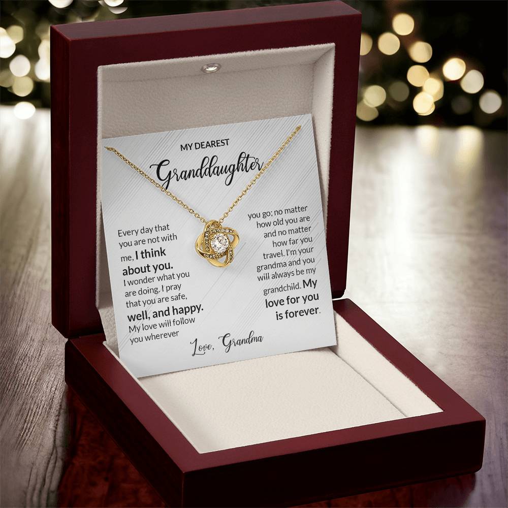 Granddaughter gift from grandma with love knot necklace and special message in luxury box with background of lights