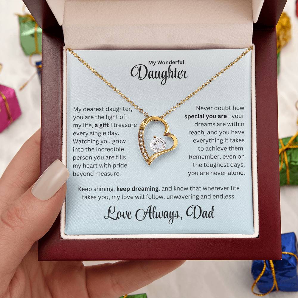 Hand holding Daughter gift from dad with forever love necklace and special message in a luxury box