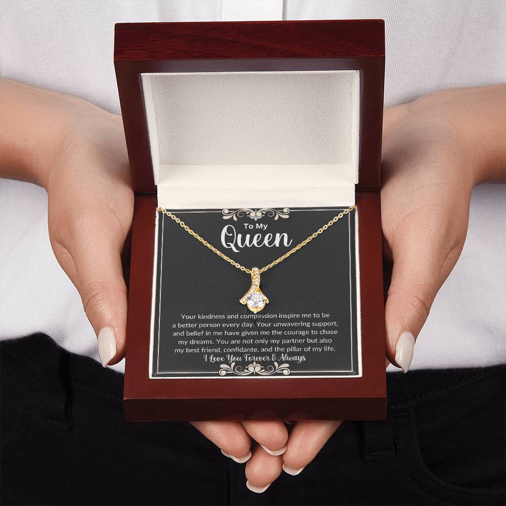 Hands holding Soulmate gift with alluring beauty necklace and special message in luxury box