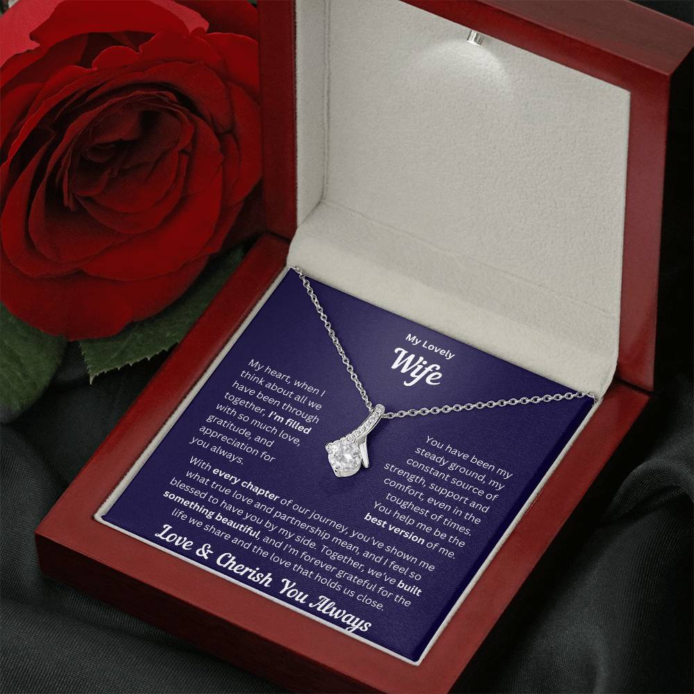 Wife gift with alluring necklace and special message in a luxury box with rose