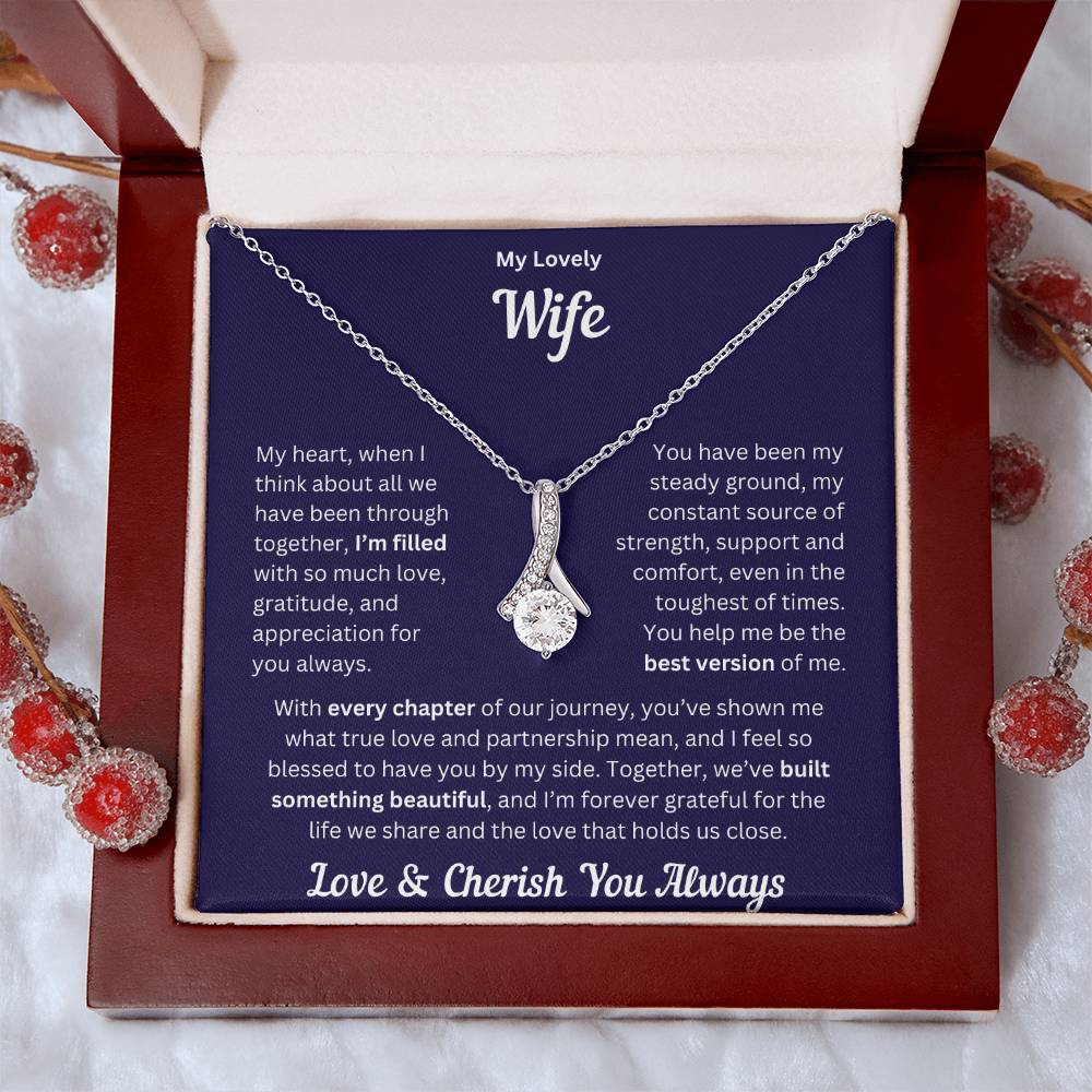 Wife gift with alluring necklace and special message in a luxury box with props