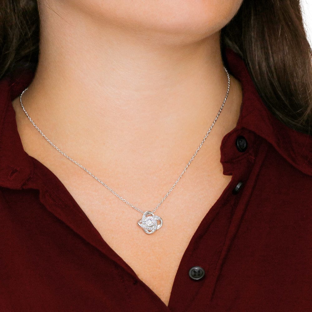 Person Wearing Loved Knot Necklace in Polished Stainless Steel