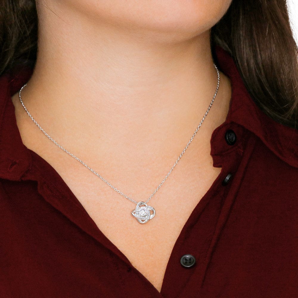 Person Wearing The Love Knot Necklace