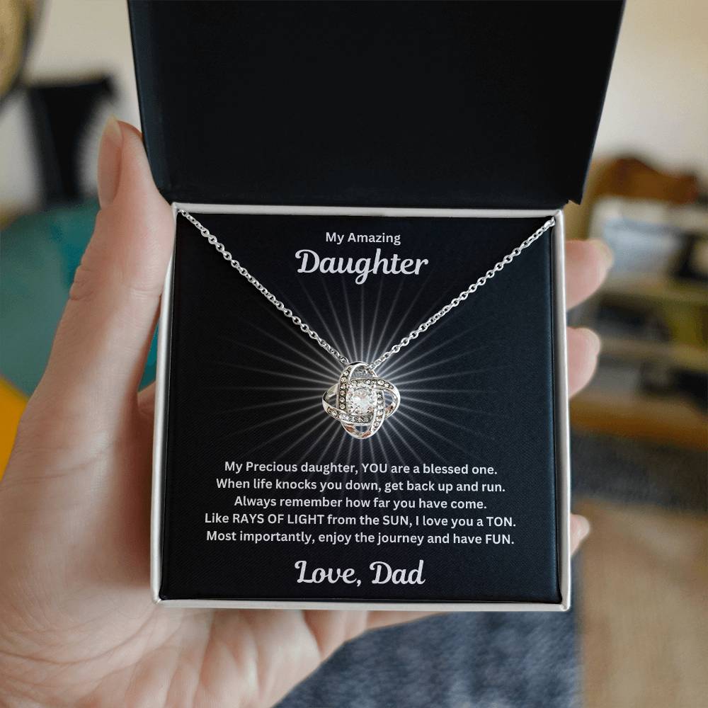 Hand holding Daughter gift from dad with love not necklace and special sentiment in a standard box