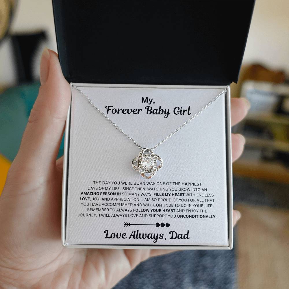 Hand holding Dad to daughter gift with the love knot necklace and special message in a standard box