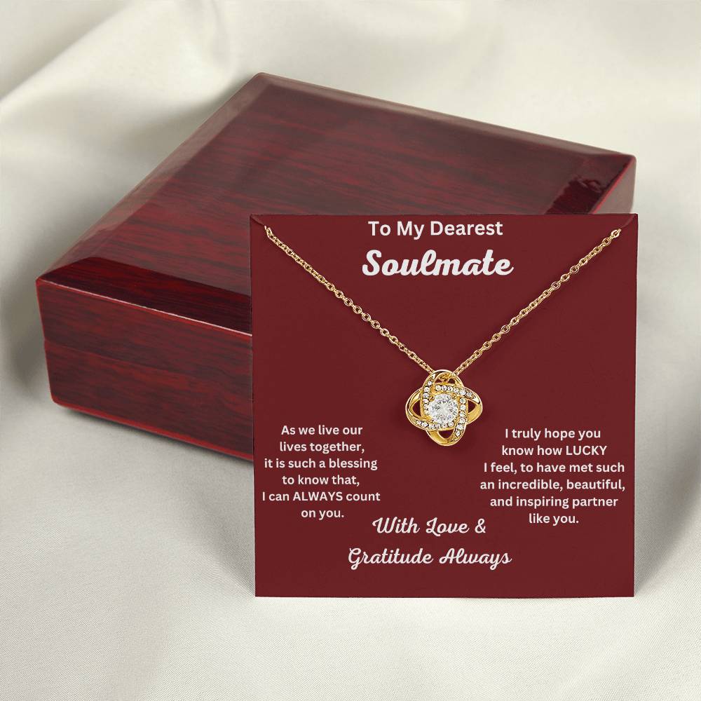 Soulmate Gift - Love Knot Necklace In 18K Yellow Gold Finish With Message Card Leaning  On Luxury Box