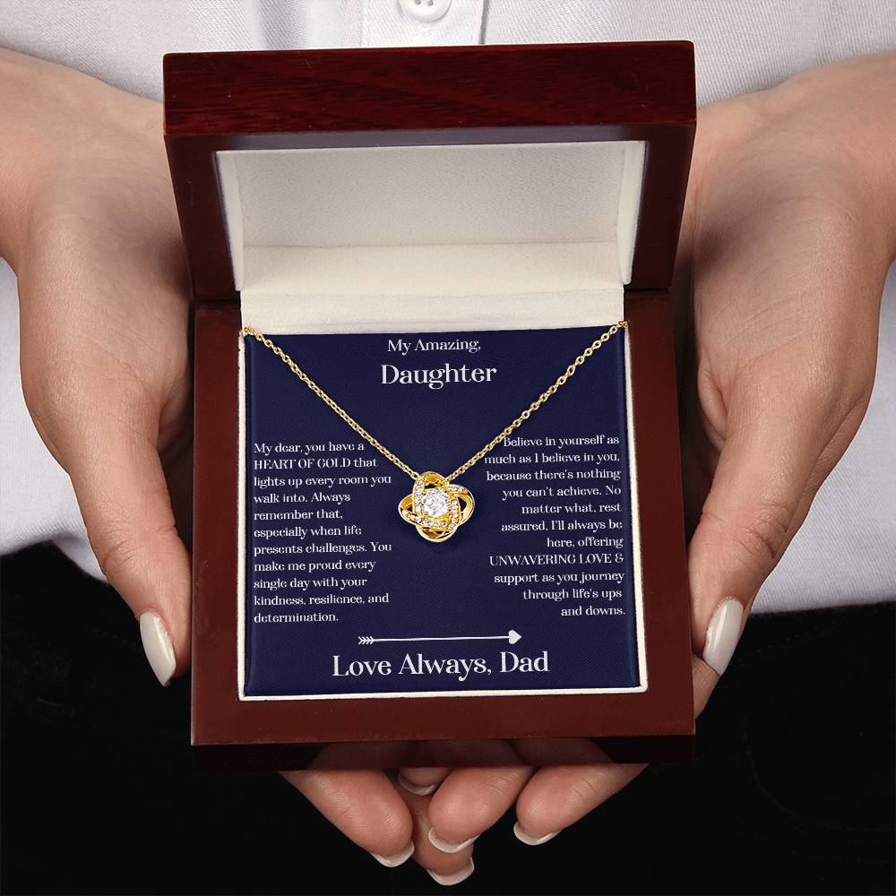 Hands holding the Daughter gift from dad with love knot necklace and special sentiment in a luxury box