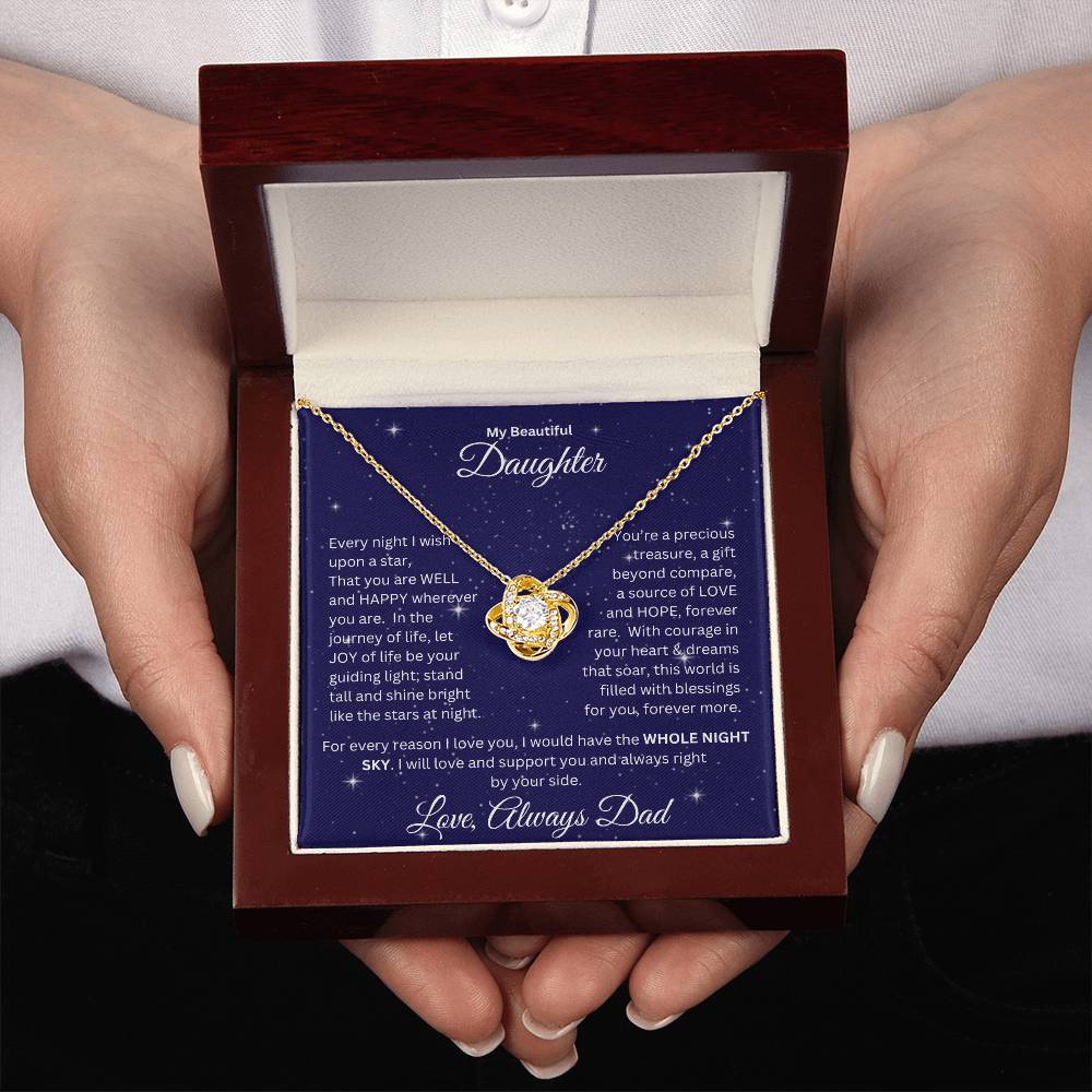 Two hands holding Daughter gift from dad with love knot necklace and special message in a ready to gift box