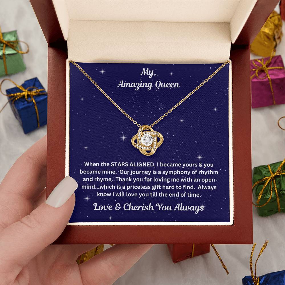 Hand holding Soulmate gift with Love Knot Necklace and special message in premium luxury box