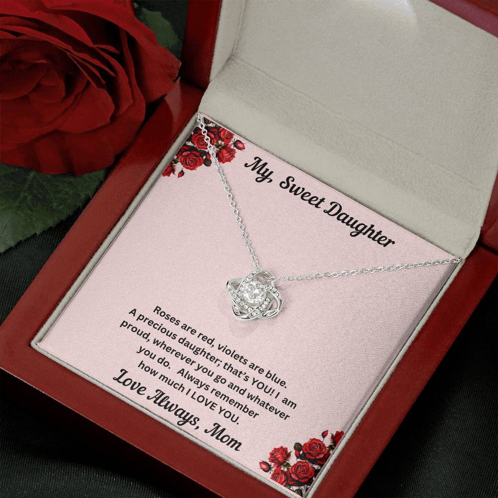 Daughter gift from mom with love knot necklace and special message in luxury box ith spotlight on