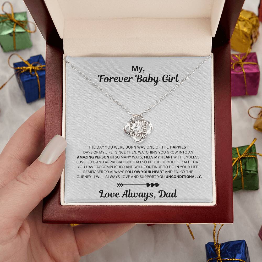 Hand holding Dad to daughter gift with the love knot necklace and special message in a luxury box