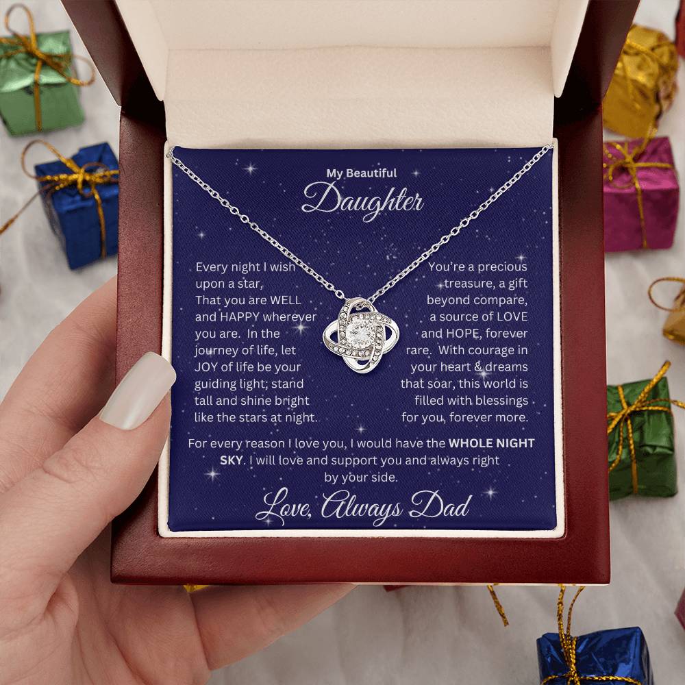 Hand holding Daughter gift from dad with love knot necklace and special message in a ready to gift luxury box with props