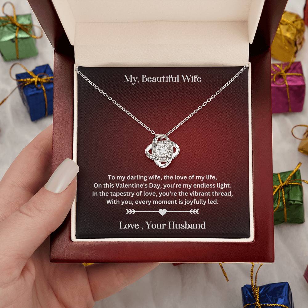 Hand Holding WIfe Valentine's Day Gift WIth Love Knot Necklace With Special Message In Luxury Box