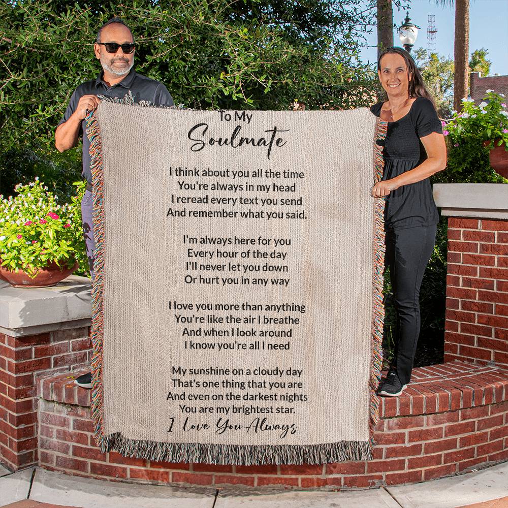 People Holding Soulmate gift with heirloom woven blanket with special message