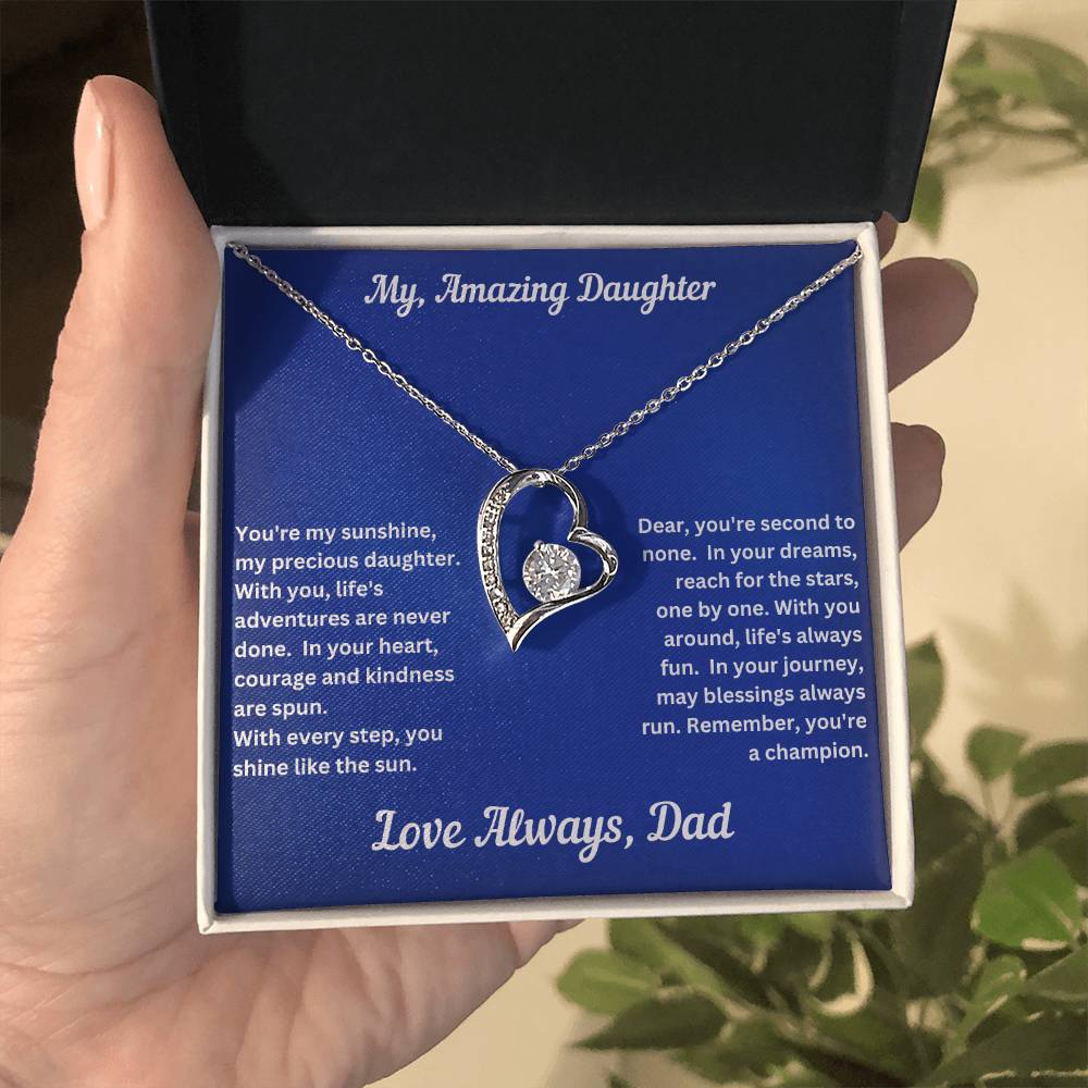 Hand holding Daughter gift from dad with forever love necklace and unique message in a standard box